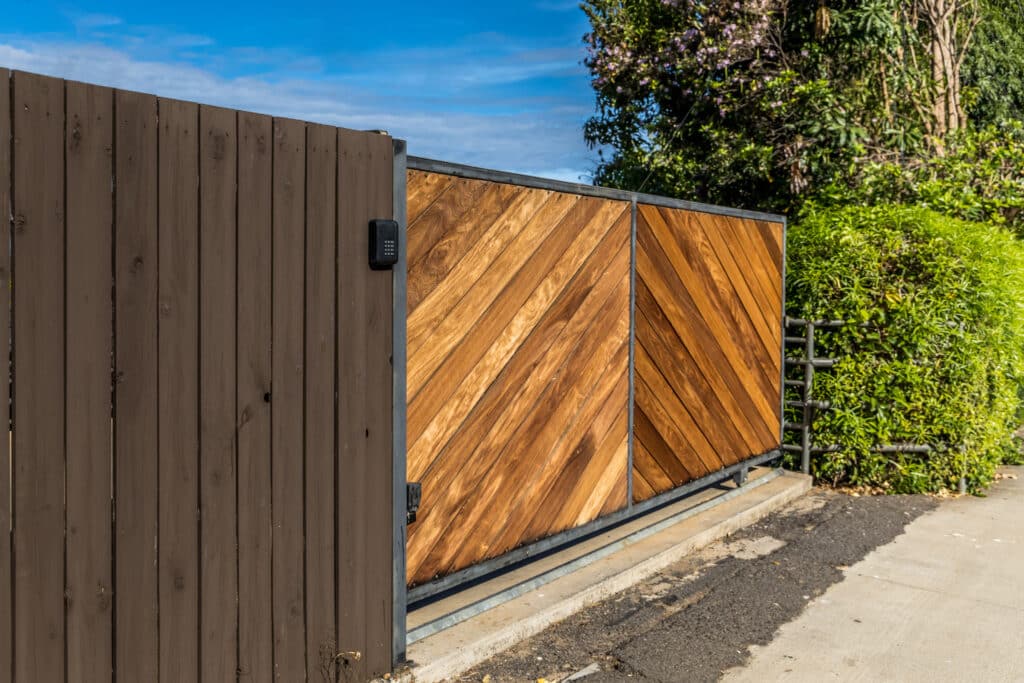 Custom sliding driveway gate installed at modern Los Angeles home