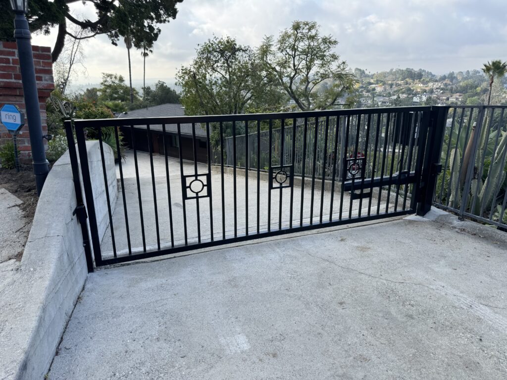 Closed residential electric gate installed by Herotec – Automatic Gates Inc., providing security and privacy at a suburban home.