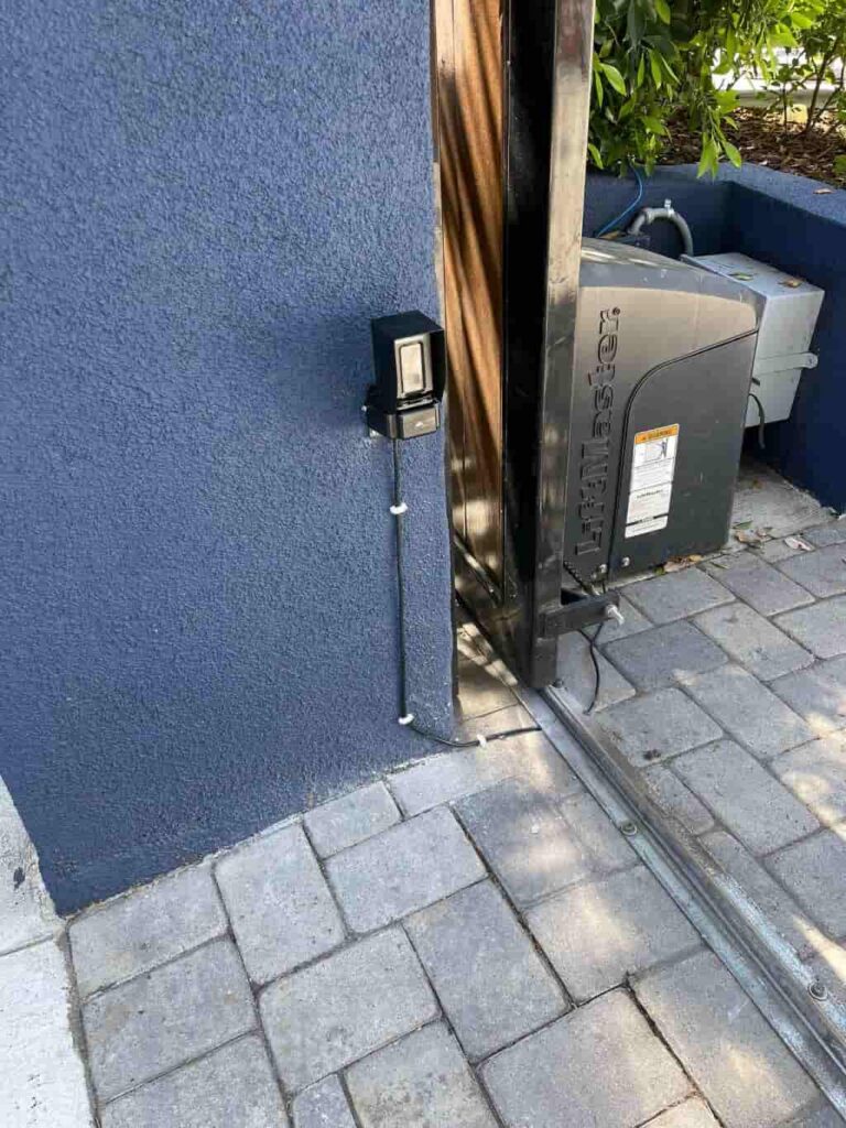 A sideview of a LiftMaster gate operator, installed by HeroTec technicians.